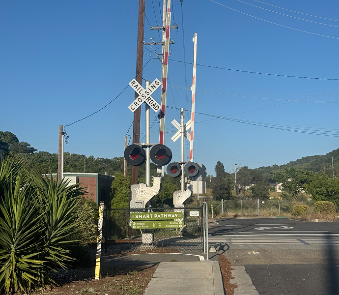 Active warning devices and interface at public highway-rail and pedestrian-rail grade crossings
